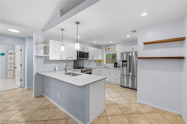 kitchen with open shelves, appliances with stainless steel finishes, a sink, a peninsula, and decorative backsplash