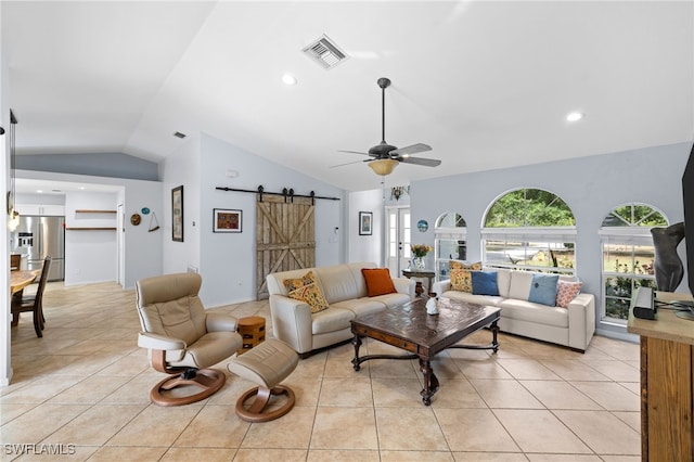 living area featuring a barn door, lofted ceiling, ceiling fan, light tile patterned floors, and recessed lighting