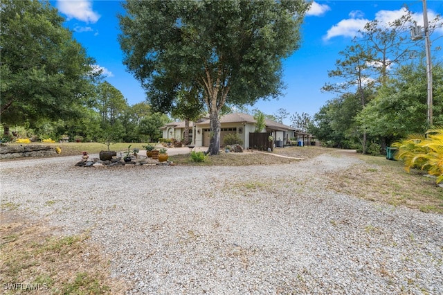 view of front of house featuring driveway and a garage