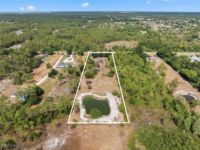 view of property location featuring a forest and property boundaries highlighted