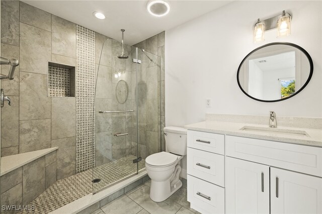 13846 Sleepy Hollow Ln, Fort Myers, FL 33905 - bathroom featuring toilet, vanity, tile patterned flooring, a stall shower, and recessed lighting