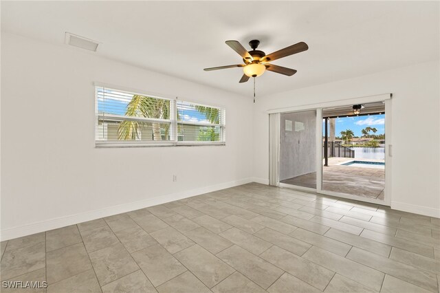 13846 Sleepy Hollow Ln, Fort Myers, FL 33905 - unfurnished room with plenty of natural light, a ceiling fan, and baseboards