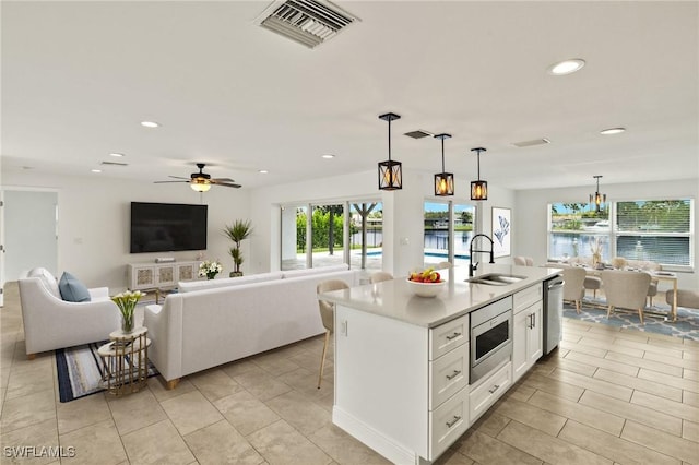 13846 Sleepy Hollow Ln, Fort Myers, FL 33905 - kitchen featuring a sink, appliances with stainless steel finishes, recessed lighting, white cabinetry, and light countertops
