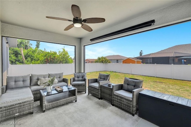 view of patio / terrace with an outdoor living space and ceiling fan