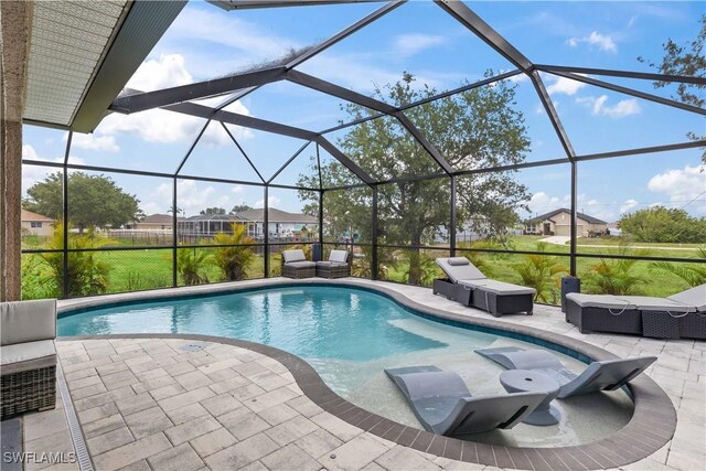 927 NW 12th Ter, Cape Coral, FL 33993 - outdoor pool featuring a patio area, outdoor lounge area, and a lanai