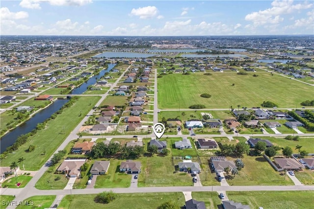 927 NW 12th Ter, Cape Coral, FL 33993 - aerial overview of property's location with a nearby body of water and nearby suburban area
