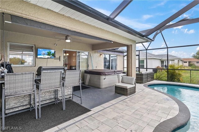 927 NW 12th Ter, Cape Coral, FL 33993 - swimming pool with a hot tub, a patio area, a ceiling fan, and glass enclosure