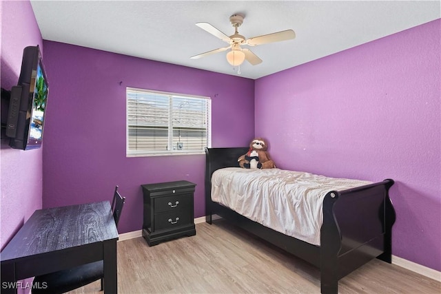927 NW 12th Ter, Cape Coral, FL 33993 - bedroom with wood finished floors, baseboards, and ceiling fan