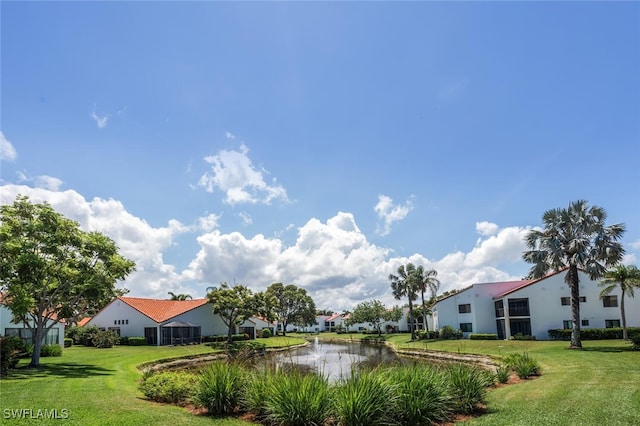 view of grassy yard with a water view