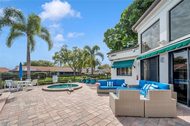 view of patio featuring a community hot tub, fence, and outdoor lounge area