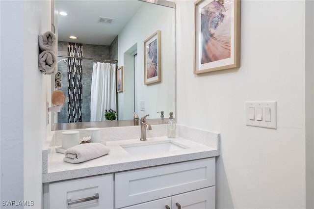 bathroom with vanity, a shower with shower curtain, and recessed lighting