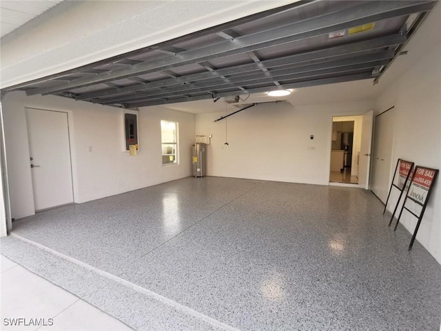 garage with electric water heater, electric panel, and a garage door opener