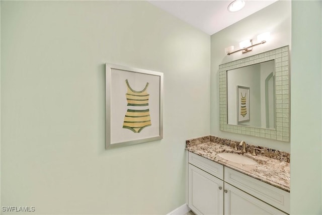2745 Tiburon Blvd E Unit 102, Naples, FL 34109 - bathroom with vanity and baseboards