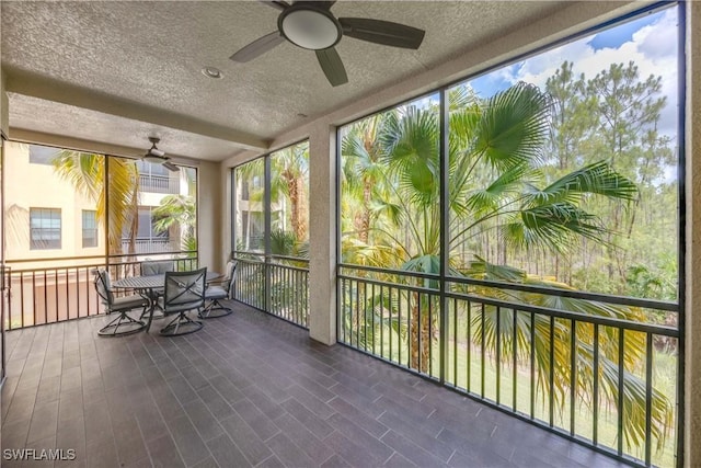 2745 Tiburon Blvd E Unit 102, Naples, FL 34109 - sunroom / solarium with a ceiling fan, a textured ceiling, and outdoor dining space