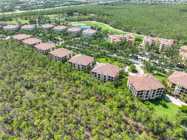 2745 Tiburon Blvd E Unit 102, Naples, FL 34109 - aerial view of a forest and a nearby body of water