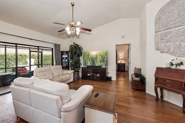 6721 Southwell Dr, Fort Myers, FL 33966 - living area with vaulted ceiling, a ceiling fan, wood finished floors, and baseboards