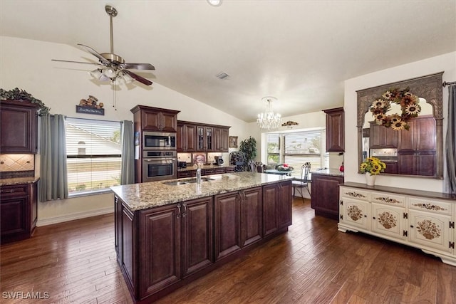 6721 Southwell Dr, Fort Myers, FL 33966 - kitchen featuring appliances with stainless steel finishes, lofted ceiling, dark wood-type flooring, a ceiling fan, and a chandelier
