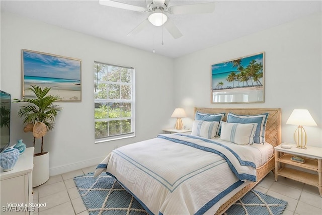 1704 Kings Lake Blvd Unit 105, Naples, FL 34112 - bedroom with light tile patterned floors, ceiling fan, and baseboards