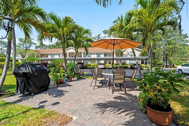 1704 Kings Lake Blvd Unit 105, Naples, FL 34112 - view of patio with area for grilling