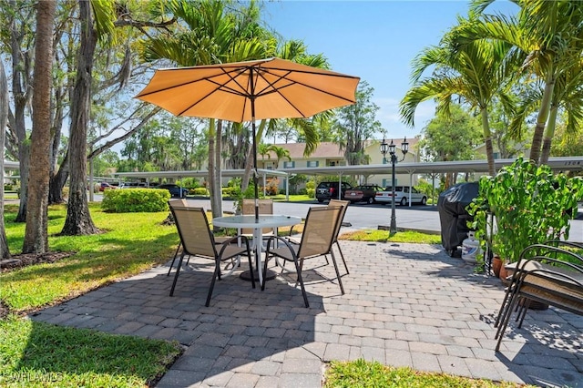 1704 Kings Lake Blvd Unit 105, Naples, FL 34112 - view of patio / terrace with outdoor dining area