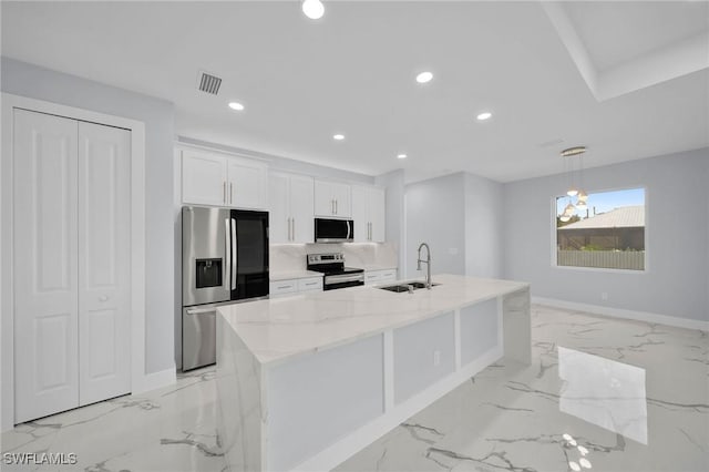 3800 11th St SW, Lee, FL 33976 - kitchen with appliances with stainless steel finishes, white cabinetry, a sink, light marble finish floors, and recessed lighting