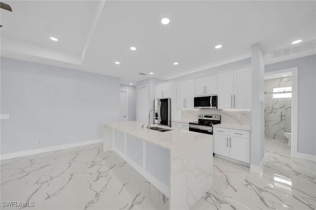 3800 11th St SW, Lee, FL 33976 - kitchen featuring stainless steel appliances, a sink, light marble finish floors, white cabinetry, and recessed lighting