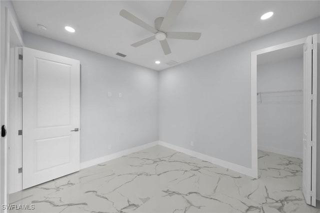 3800 11th St SW, Lee, FL 33976 - unfurnished bedroom featuring marble finish flooring, recessed lighting, baseboards, a spacious closet, and a closet