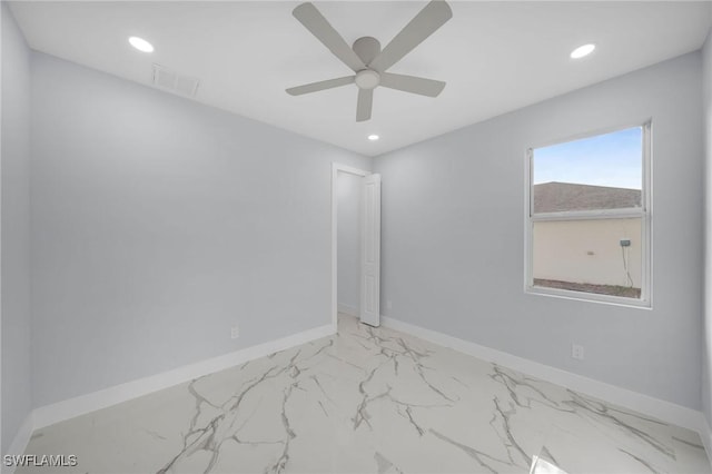 3800 11th St SW, Lee, FL 33976 - empty room featuring a ceiling fan, light marble finish floors, recessed lighting, and baseboards