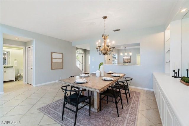 10334 Quail Crown Dr, Naples, FL 34119 - dining room featuring a chandelier, light tile patterned flooring, baseboards, and recessed lighting
