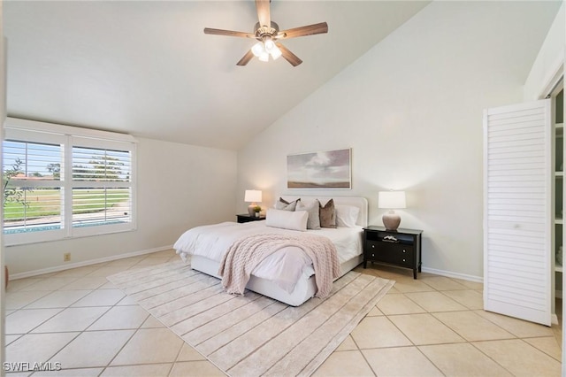 10334 Quail Crown Dr, Naples, FL 34119 - bedroom with light tile patterned floors, baseboards, high vaulted ceiling, and ceiling fan