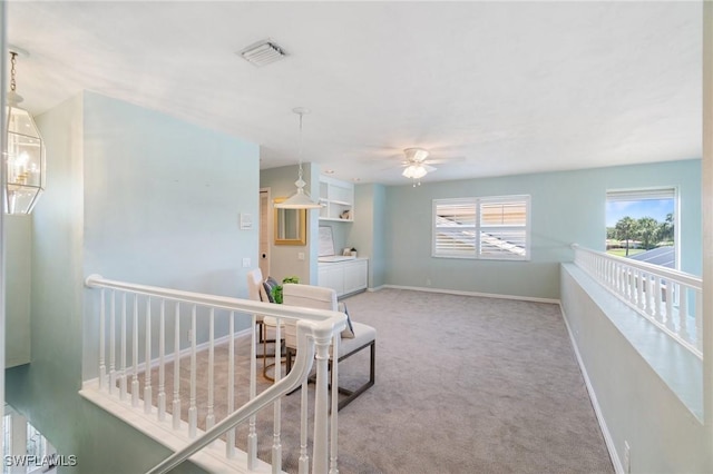 10334 Quail Crown Dr, Naples, FL 34119 - hall featuring an upstairs landing, carpet, and baseboards
