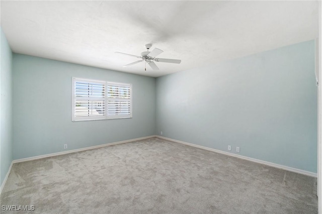 10334 Quail Crown Dr, Naples, FL 34119 - unfurnished room featuring carpet floors, a ceiling fan, and baseboards