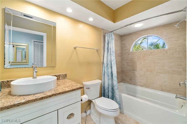 10334 Quail Crown Dr, Naples, FL 34119 - bathroom featuring shower / bath combo with shower curtain, toilet, vanity, recessed lighting, and tile patterned floors
