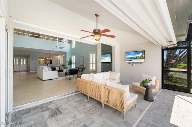 10334 Quail Crown Dr, Naples, FL 34119 - living area featuring ceiling fan, a chandelier, and vaulted ceiling