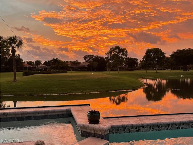 10334 Quail Crown Dr, Naples, FL 34119 - view of home's community with a water view and a lawn