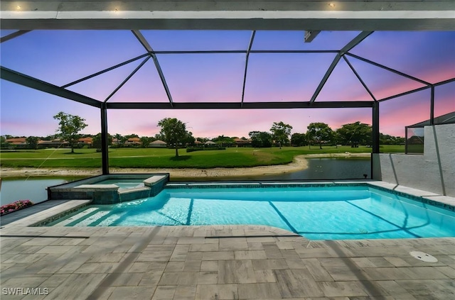 10334 Quail Crown Dr, Naples, FL 34119 - view of swimming pool with a water view, a yard, a pool with connected hot tub, and a patio
