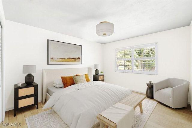 10334 Quail Crown Dr, Naples, FL 34119 - bedroom with light wood-style floors