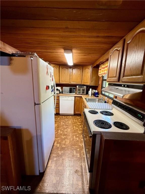 304 Flagler St, Clewiston, FL 33440 - kitchen with white appliances, a sink, range hood, wood ceiling, and brown cabinetry