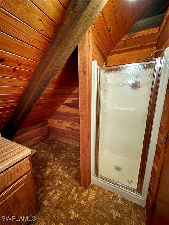 304 Flagler St, Clewiston, FL 33440 - bathroom featuring wood walls and a stall shower
