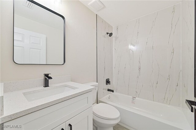 4733/4735 28th St SW, Lehigh Acres, FL 33973 - bathroom with toilet, vanity, and bathing tub / shower combination