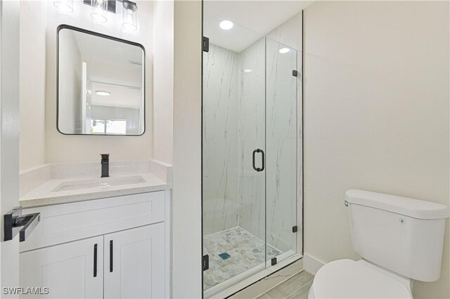 4733/4735 28th St SW, Lehigh Acres, FL 33973 - full bathroom featuring toilet, a marble finish shower, vanity, and recessed lighting