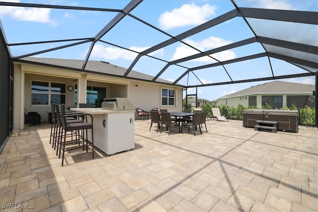 view of patio / terrace featuring a hot tub and glass enclosure