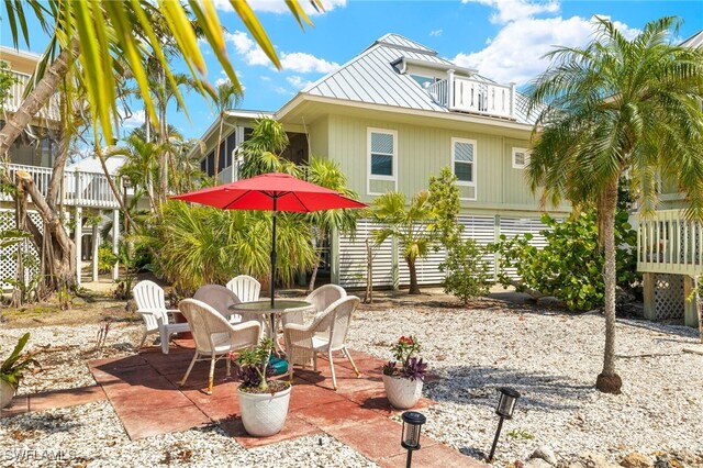 view of patio / terrace featuring outdoor dining space and a balcony