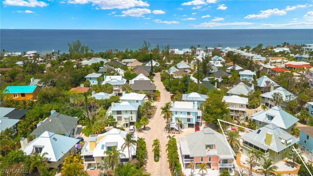 aerial view of residential area with a nearby body of water