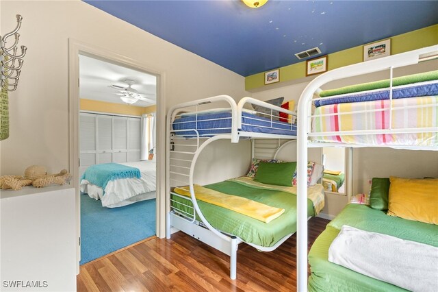 bedroom featuring wood finished floors and a closet