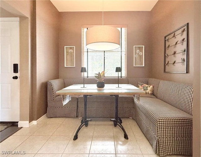 living area featuring tile patterned floors