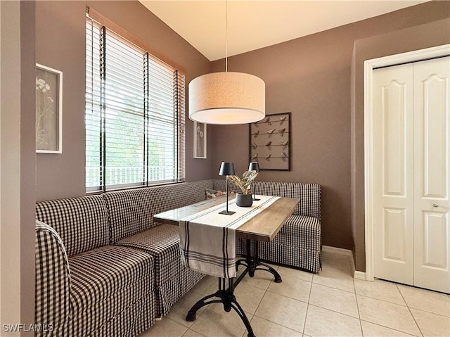 dining area with light tile patterned flooring