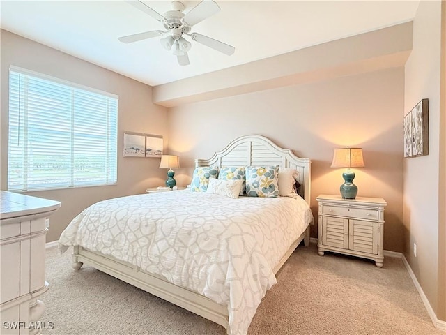 carpeted bedroom with baseboards and ceiling fan