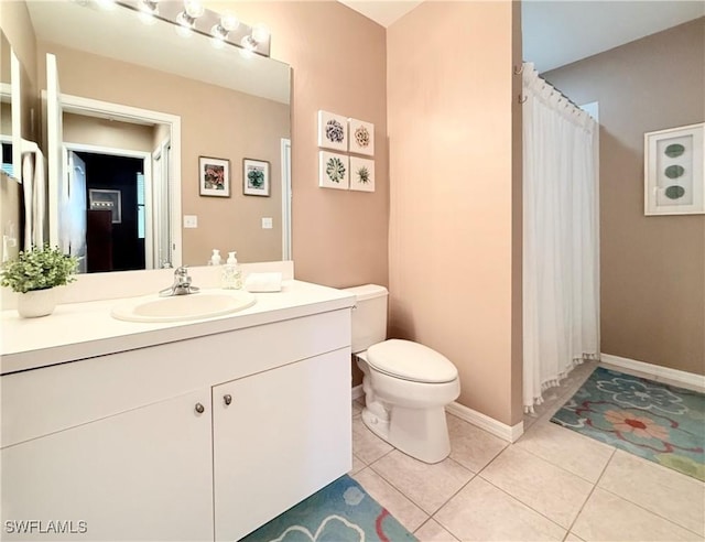 bathroom featuring toilet, vanity, tile patterned floors, curtained shower, and baseboards