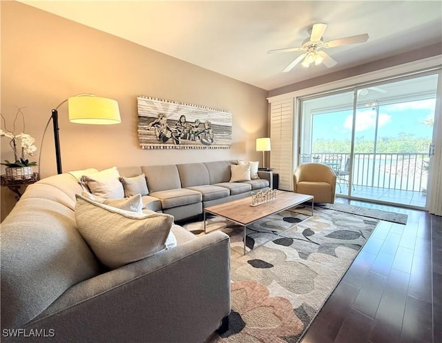 living room with wood finished floors and ceiling fan